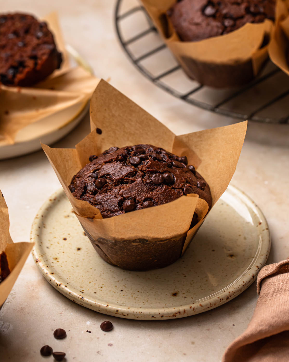 Gluten Free Chocolate Zucchini Muffin sitting on a plate.