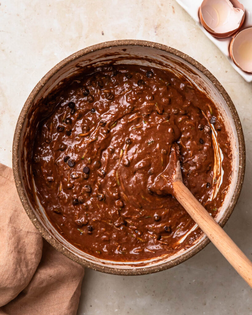 Gluten free chocolate zucchini muffins batter in a bowl. 