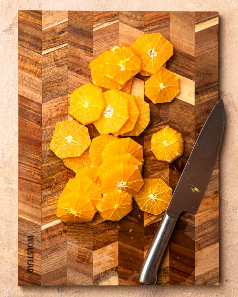 Orange slices on a chopping board. 