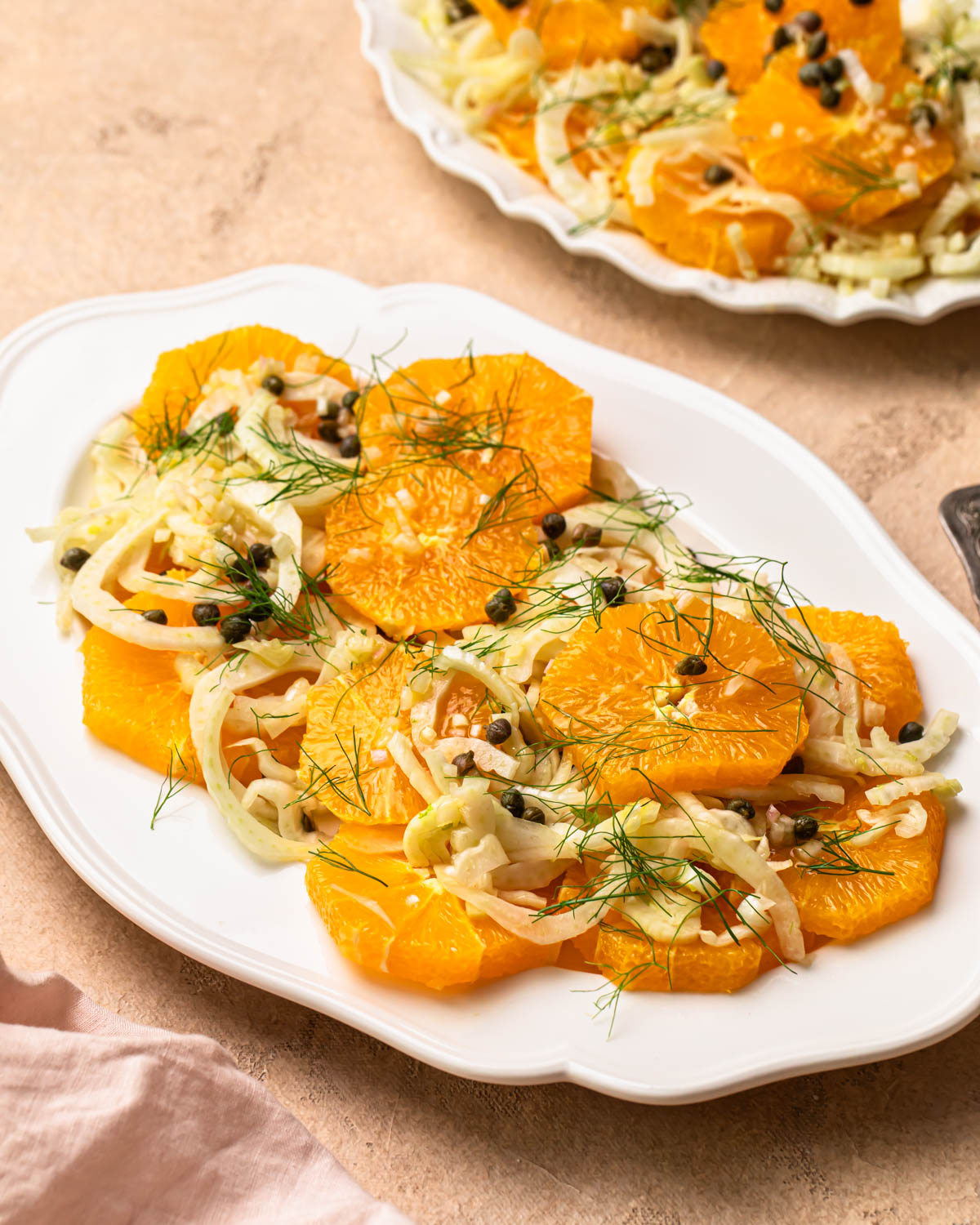 Front on photo of Orange and fennel salad on a platter.
