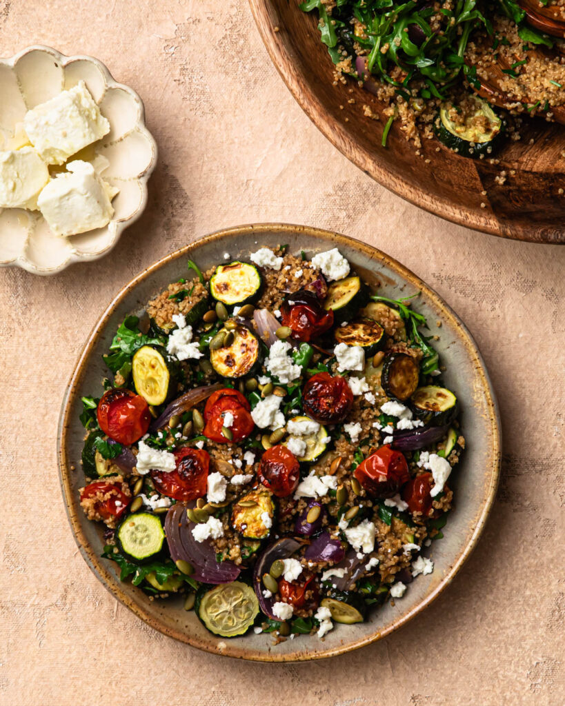Roasted zucchini and quinoa salad topped with toasted pumpkin seeds and crumbled goats cheese. 