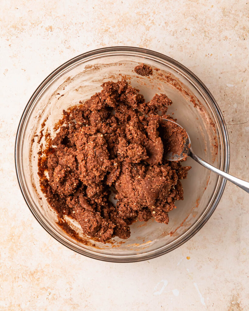 Mixture for chocolate protein balls in a bowl.