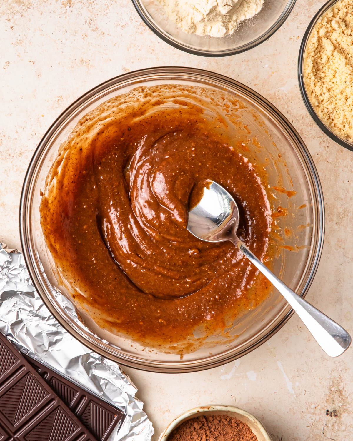 Wet ingredients for double chocolate protein balls whisked together in a bowl. 