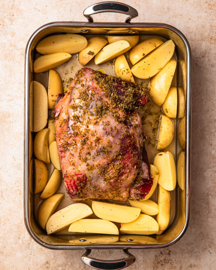 Lamb shoulder with lemony potatoes all prepped in a roasting pan and ready to cook. 