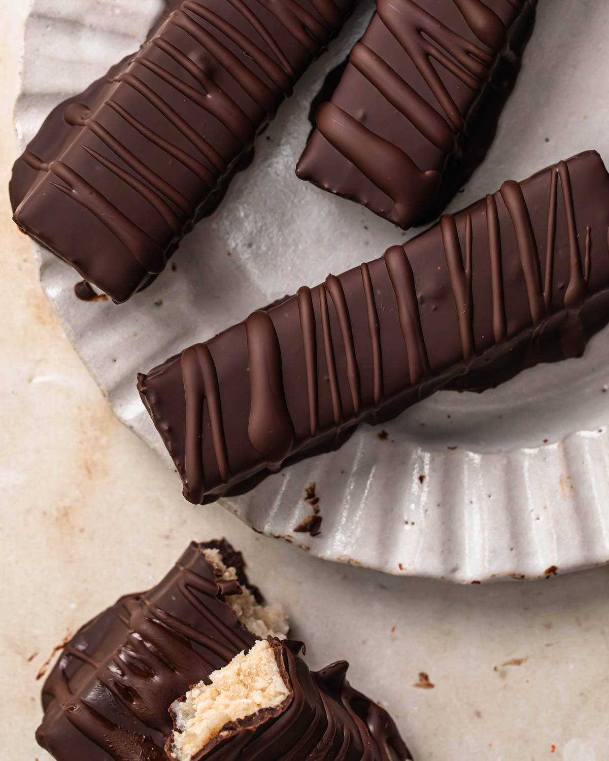 Homemade bounty bars on a plate. 
