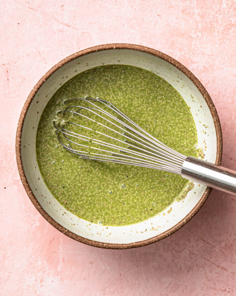 Matcha chia pudding mixture whisked together in a large bowl. 