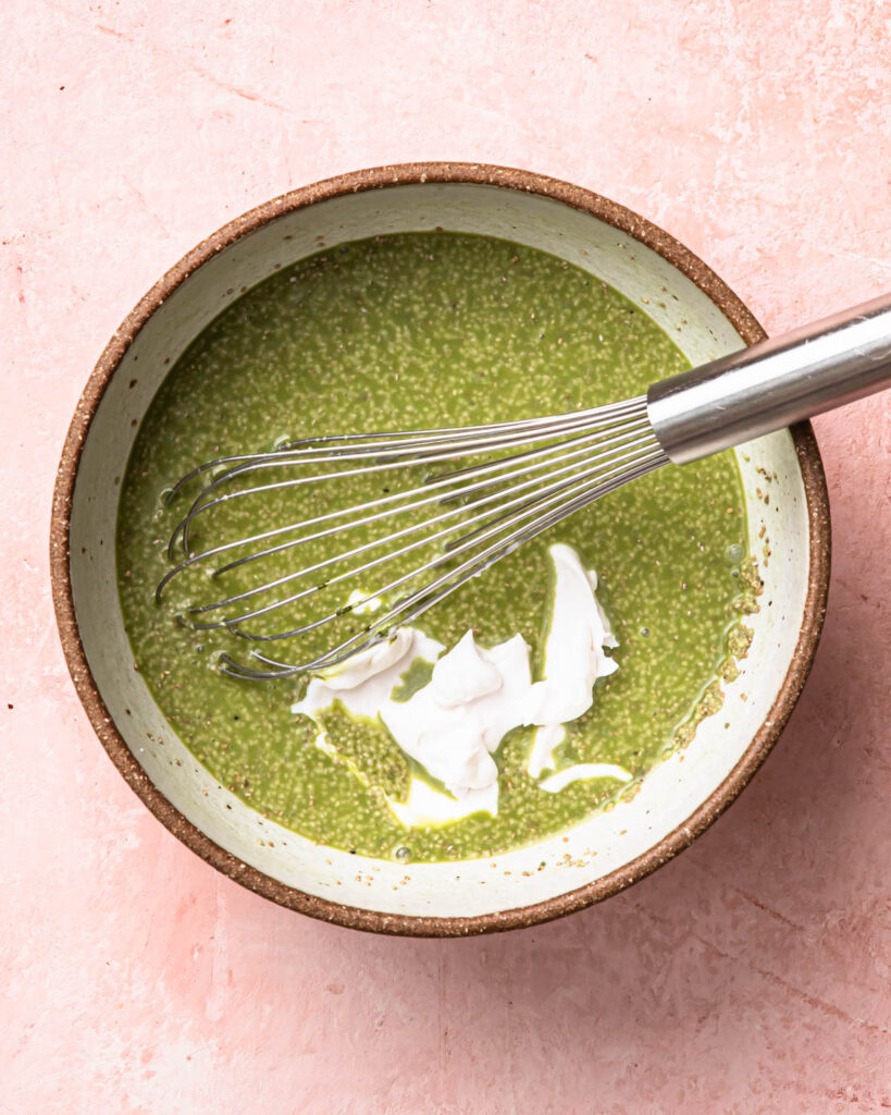 Yoghurt added to the matcha chia pudding mixture.