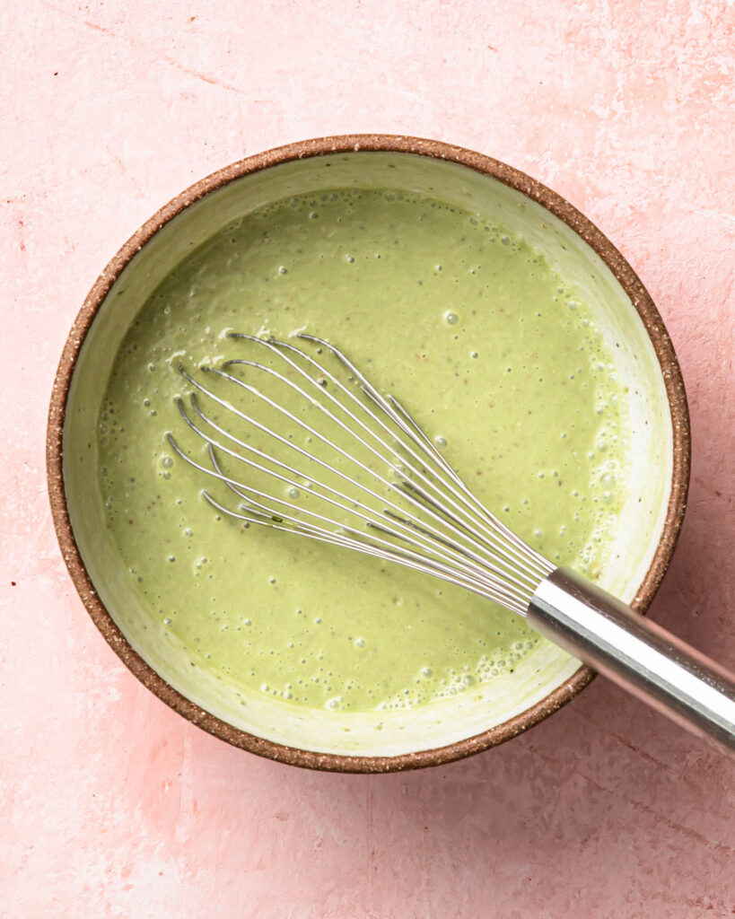 Matcha chia pudding mixture in a large bowl. 