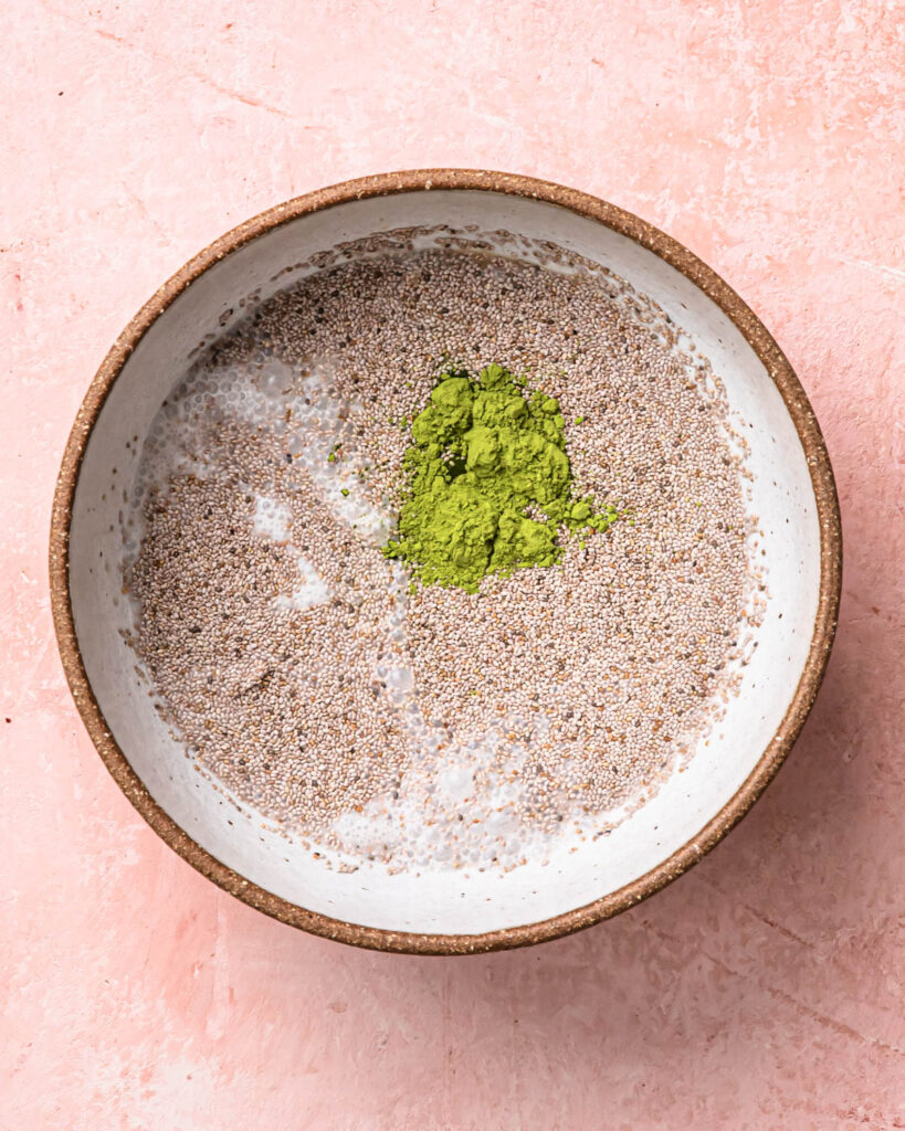 Ingredients for matcha chia pudding added to a large bowl. 