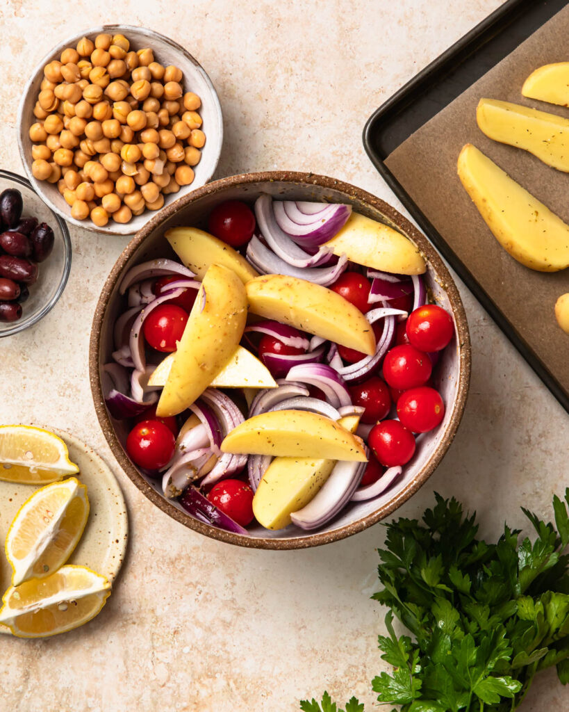 Mixed vegetables tossed through marinade in a bowl. 