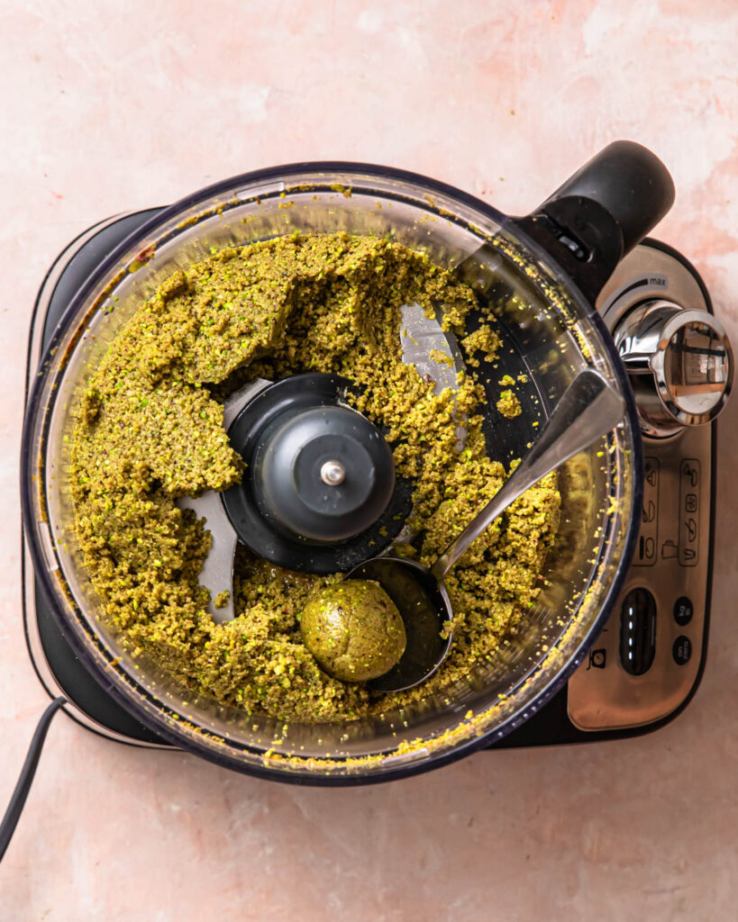 Pistachio protein ball mixture blended together in a food processor. 