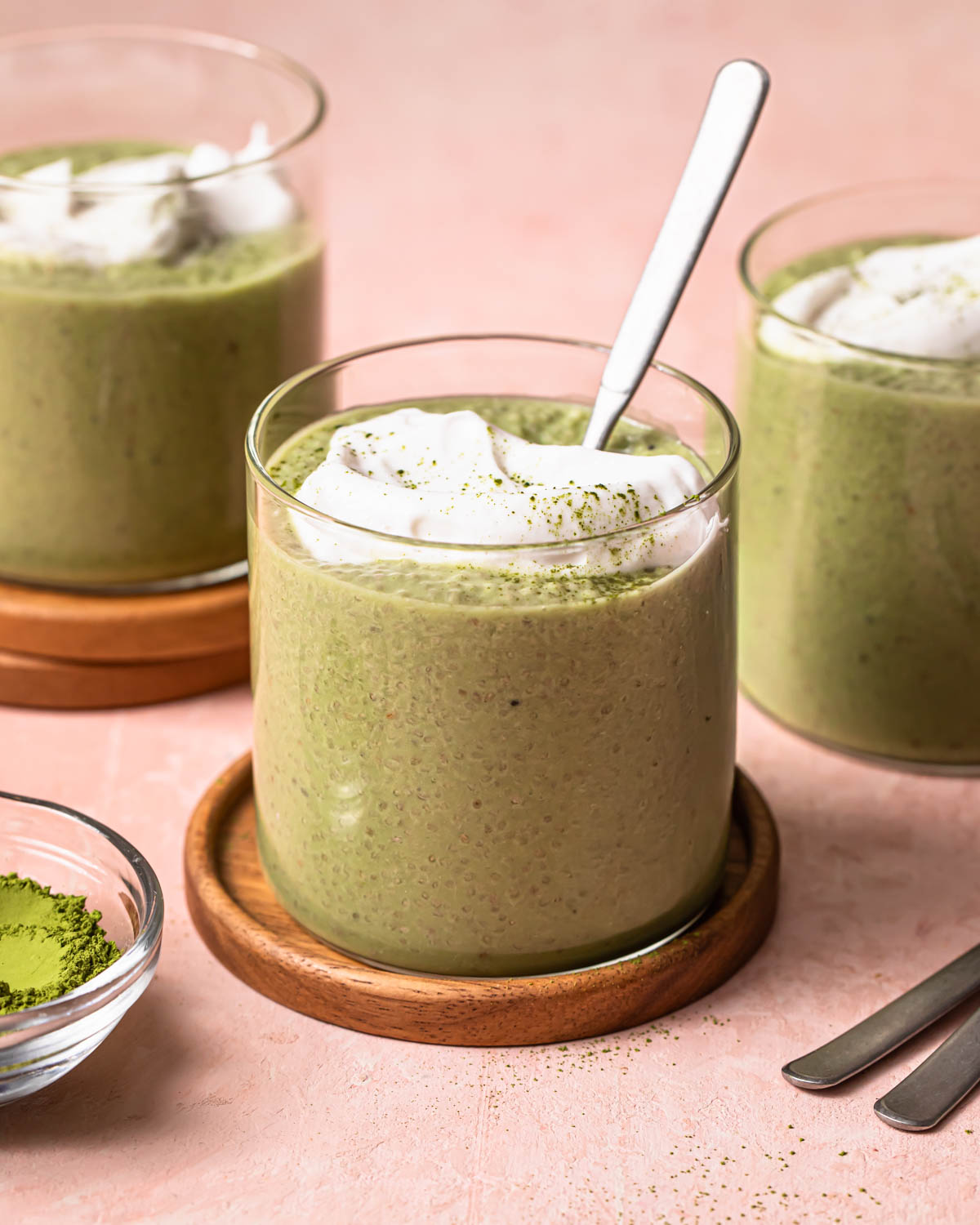Matcha chia pudding in a jar, topped with yoghurt.