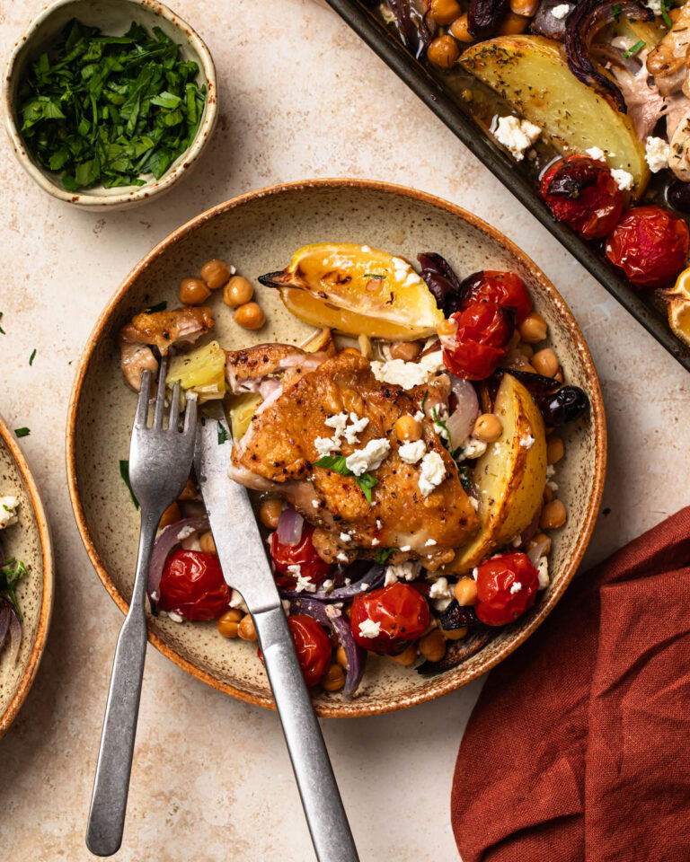 Mediterranean sheet pan chicken served in a bowl.