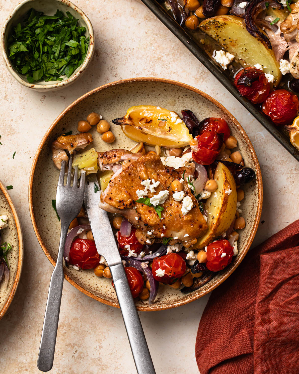 Mediterranean sheet pan chicken served in a bowl.