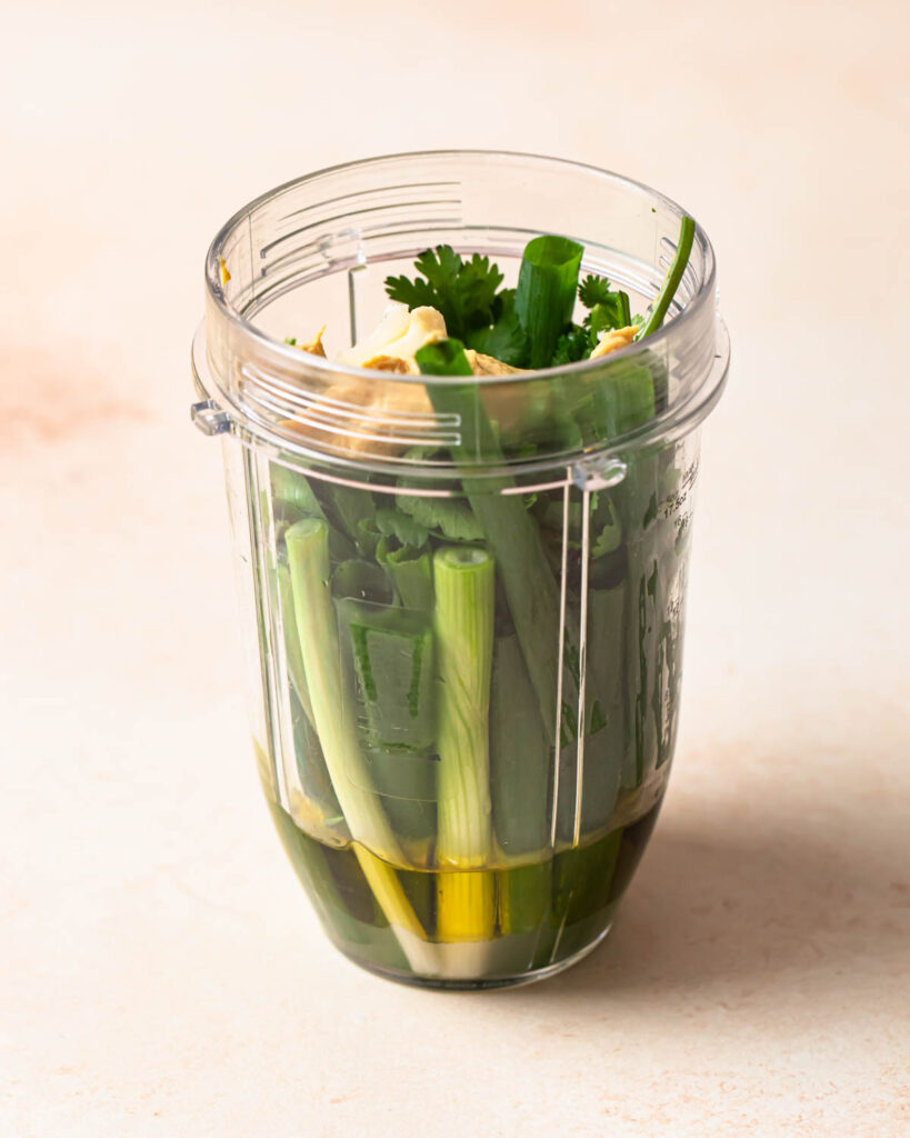 Dressing ingredients in a bullet blender jug.