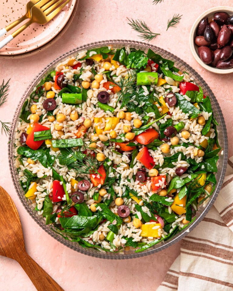 Mediterranean orzo salad in a large salad bowl.