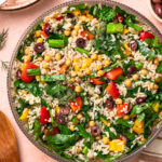 Mediterranean orzo salad in a large salad bowl.