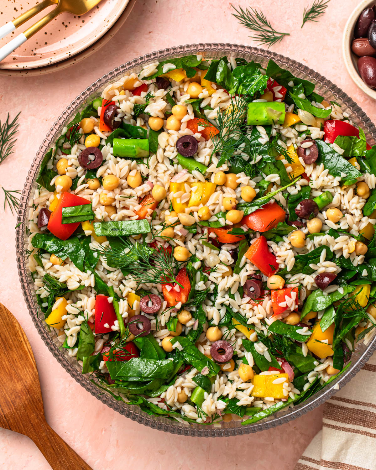 Mediterranean orzo salad in a large salad bowl.