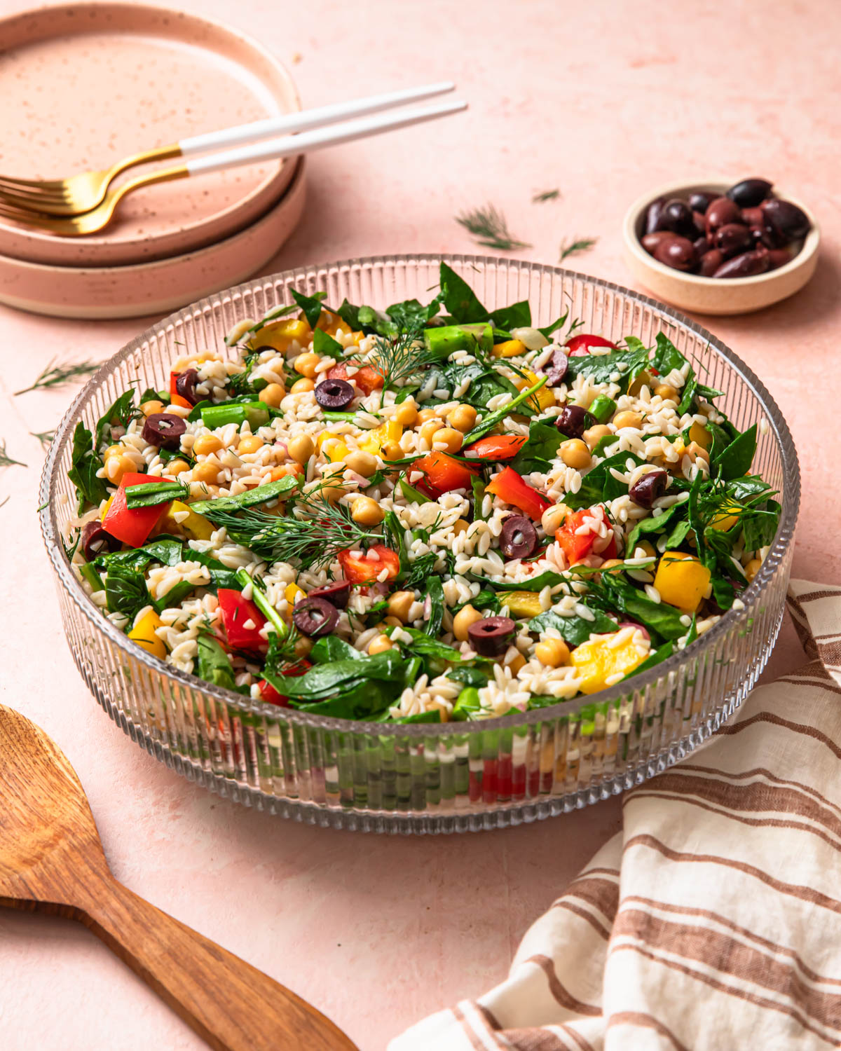 Front on photo of a Mediterranean Orzo Salad in a large bowl.