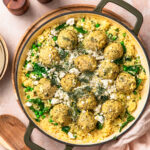 One pan greek chicken meatballs with feta and rice in a pan.
