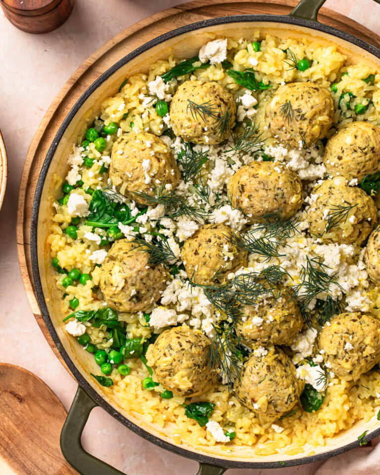 Close up of One pan greek chicken meatballs with feta and rice in a pan.