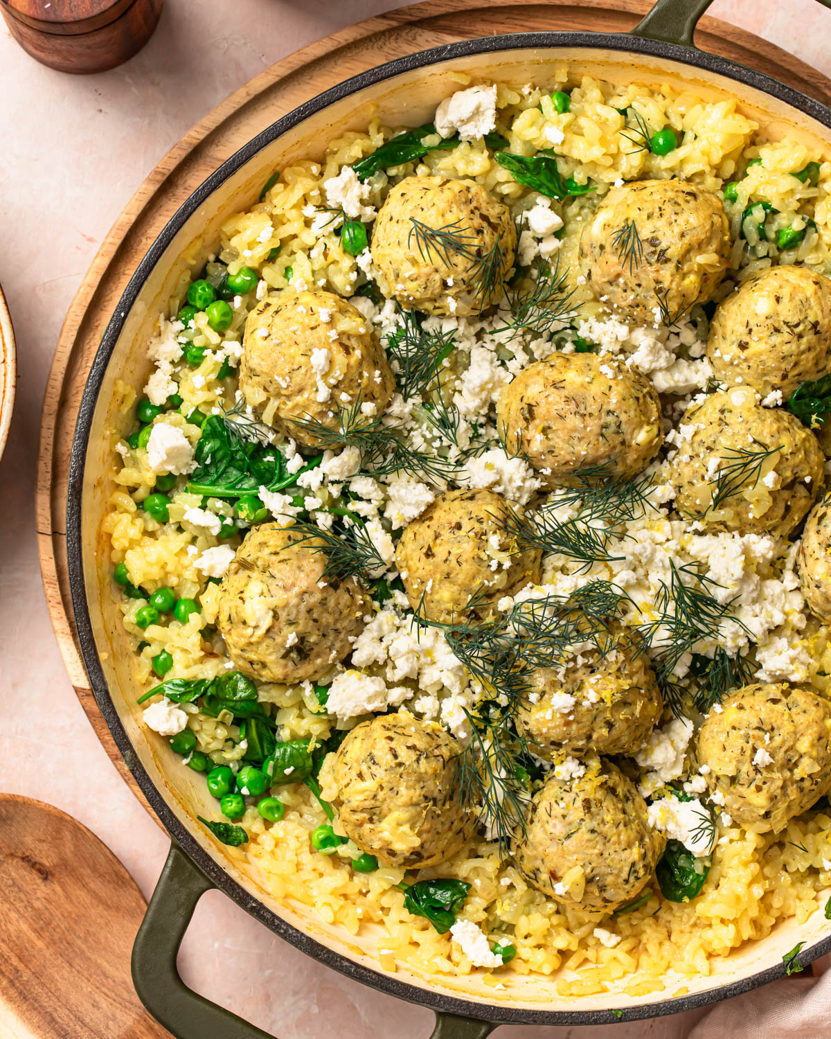 Close up of One pan greek chicken meatballs with feta and rice in a pan.