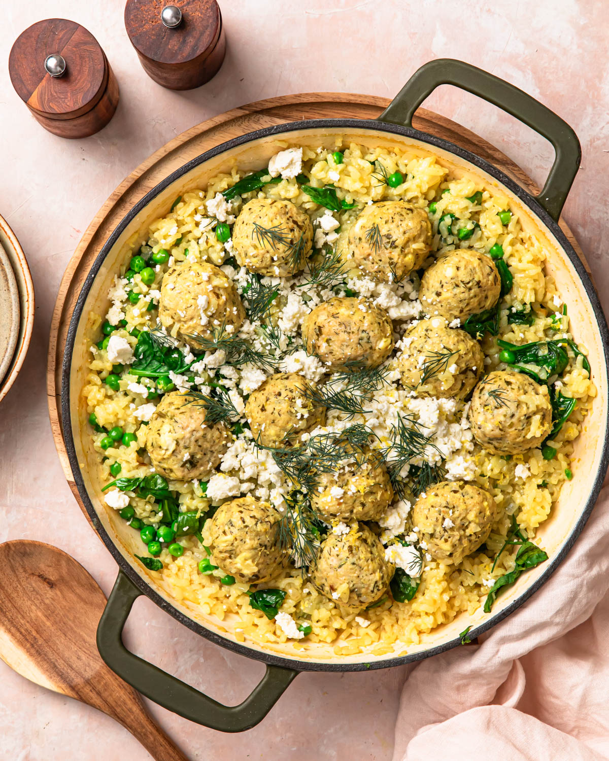 One pan greek chicken meatballs with feta and rice in a pan.