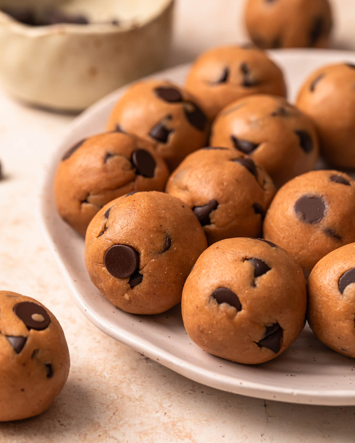 Cookie dough protein balls on a plate.