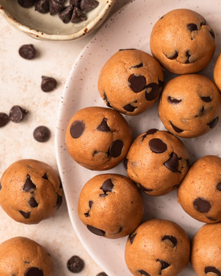 Cookie dough protein balls on a plate.