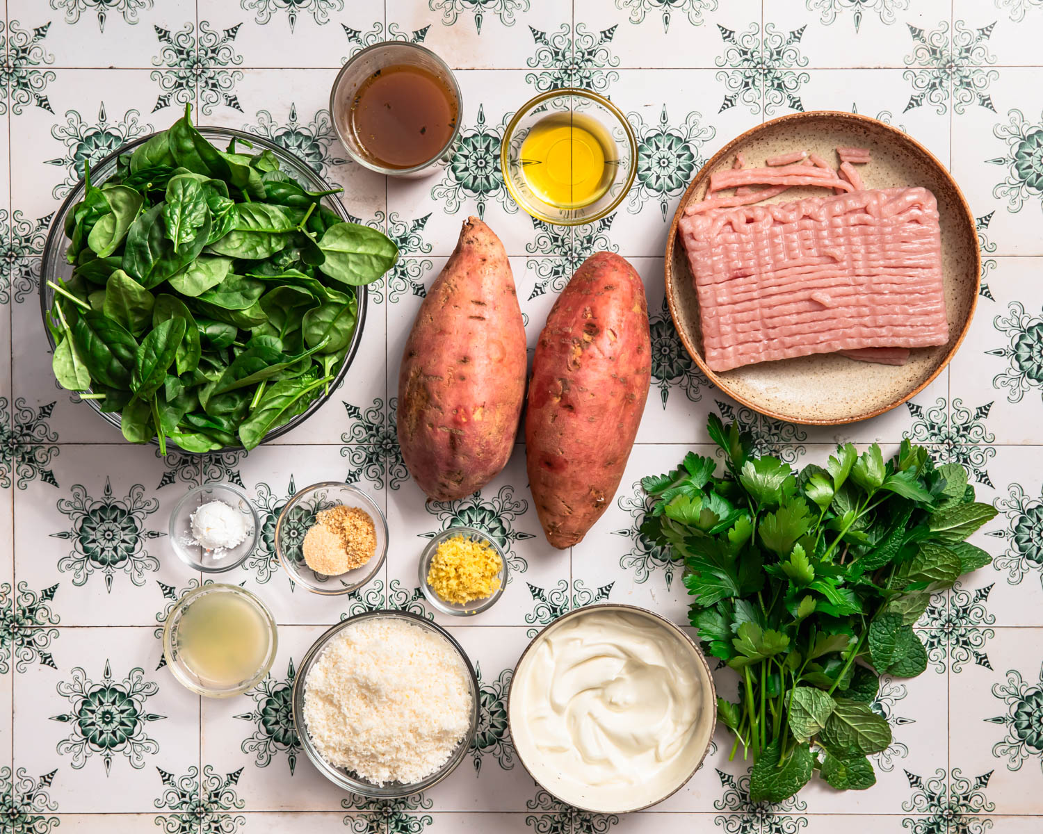 Ingredients for Ground Turkey Stuffed Sweet Potatoes laid out in individual bowls.