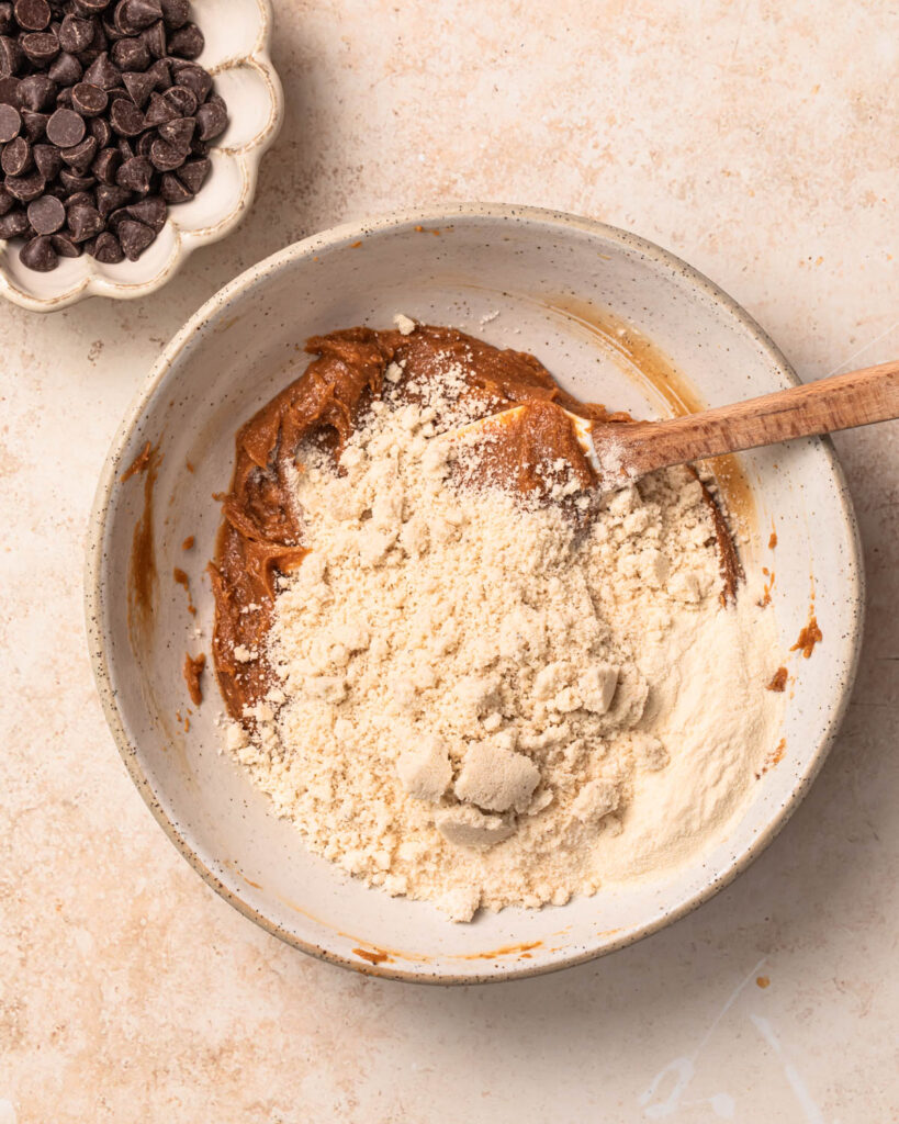 Dry ingredients added to the wet ingredients to make cookie dough protein balls. 