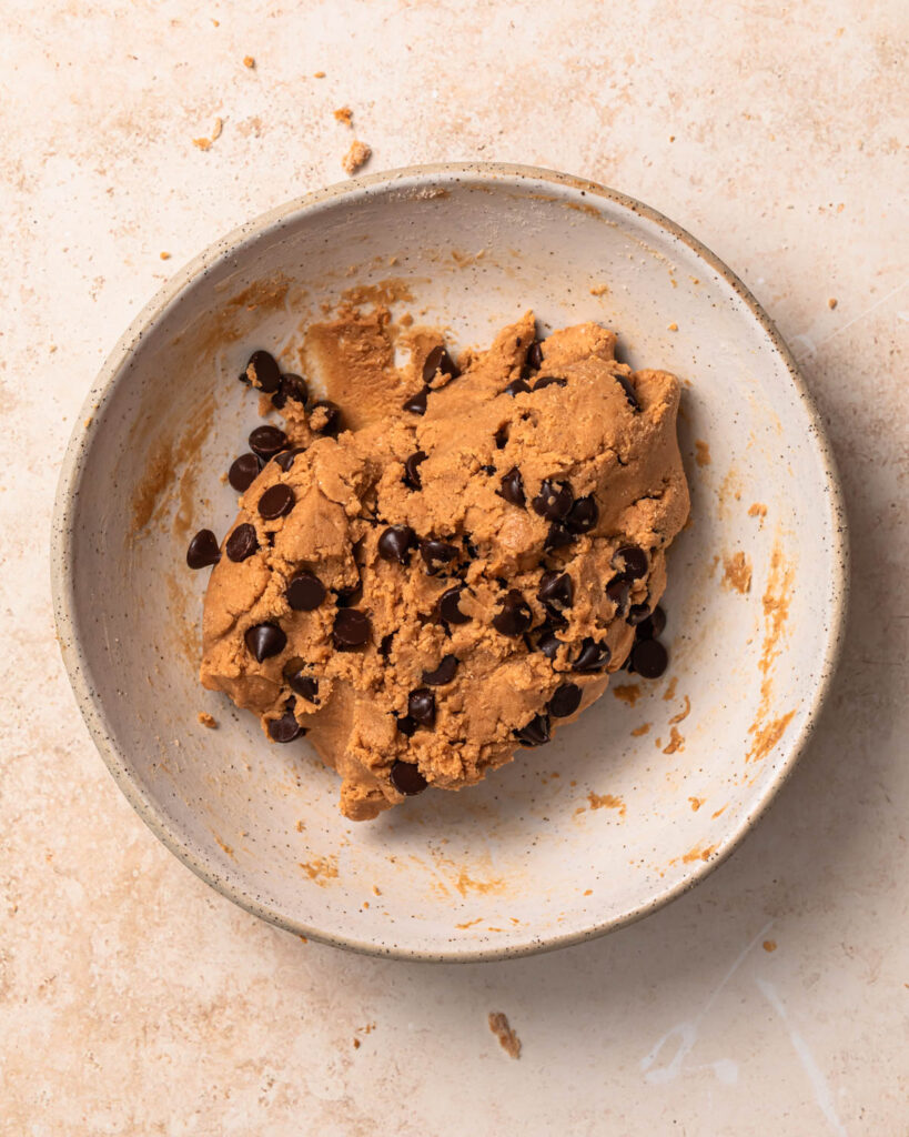 Cookie dough protein balls mixture in a bowl.