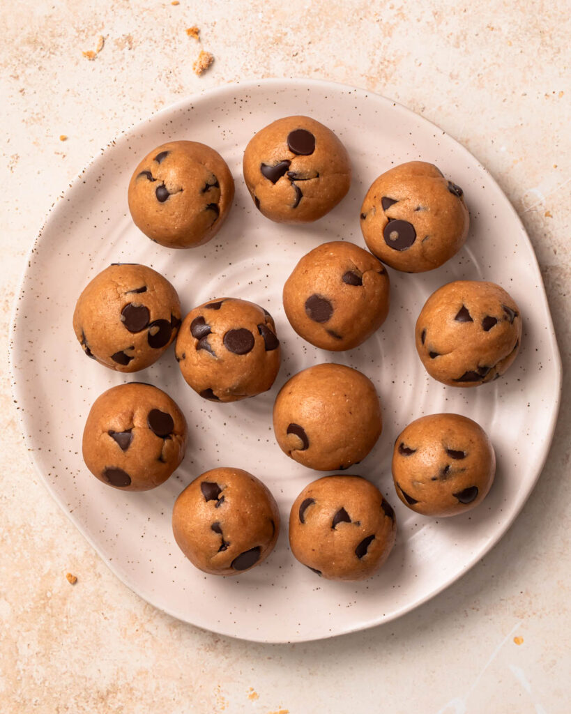 Cookie dough protein balls on a plate. 