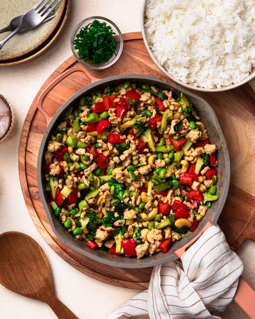 Ground chicken stir fry in a pan.