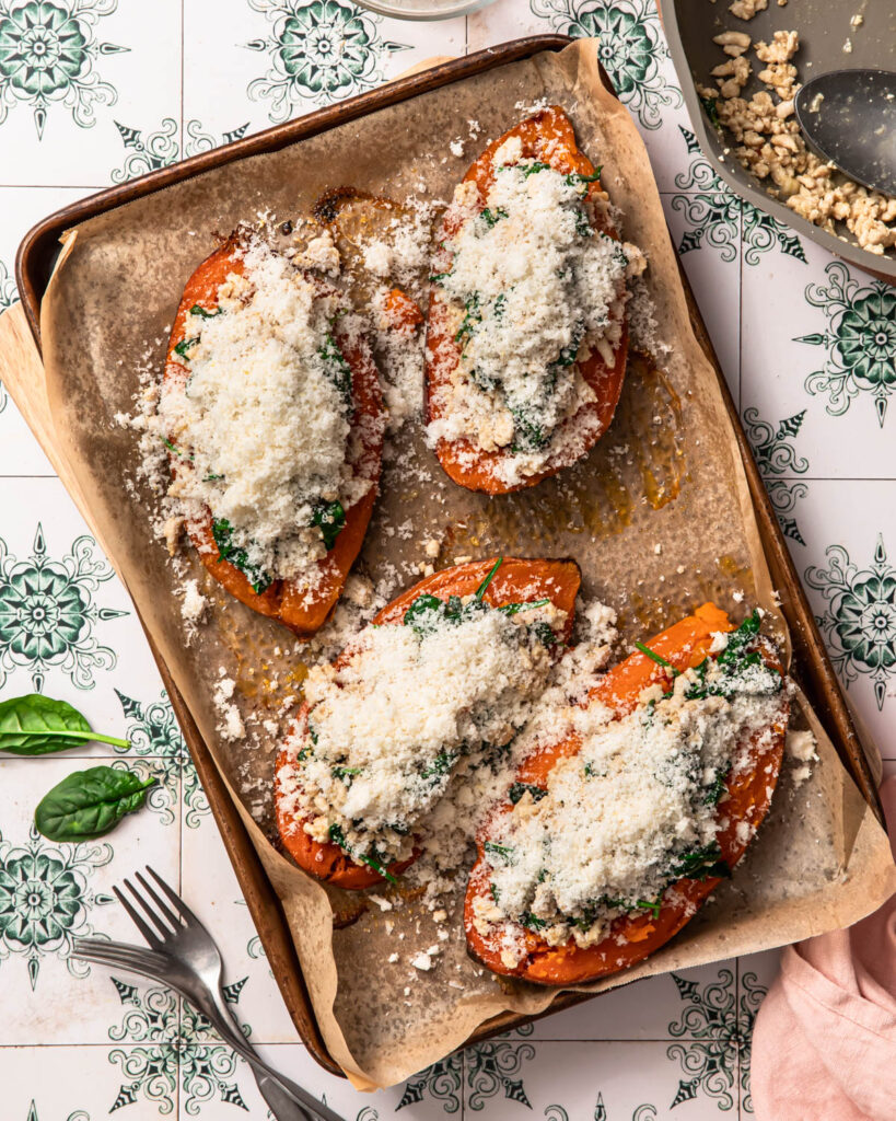 Ground turkey stuffed sweet potatoes topped with finely grated parmesan cheese.