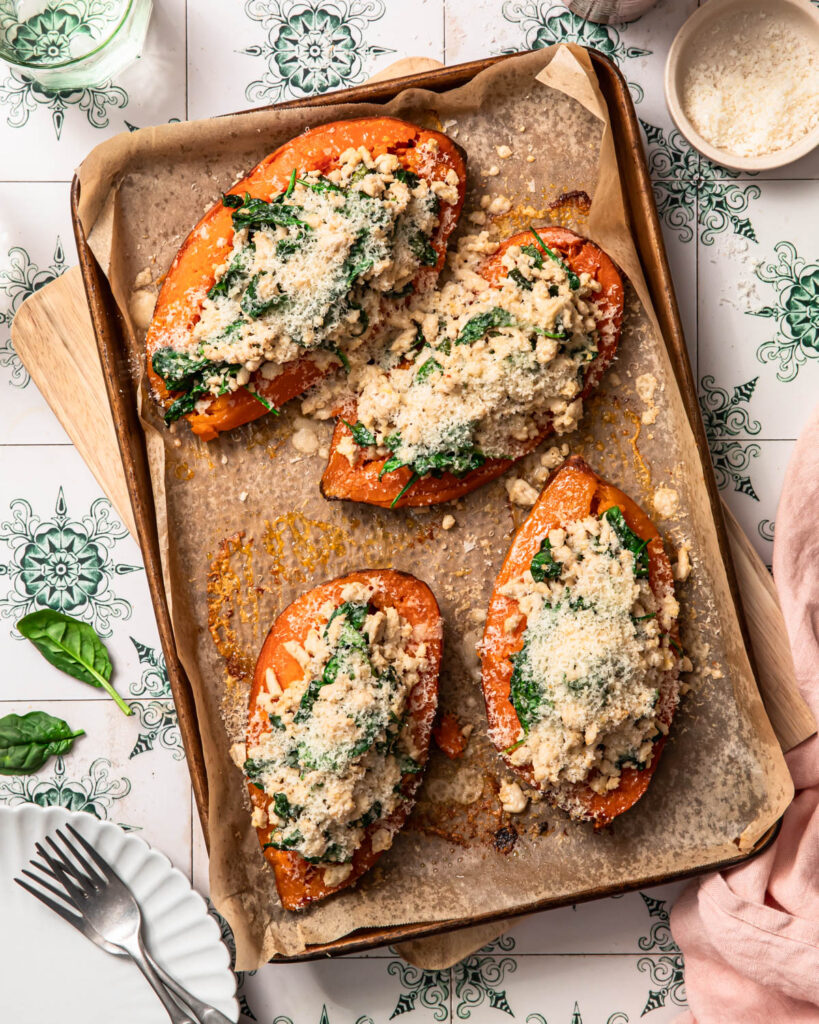 Baked Ground turkey stuffed sweet potatoes topped with finely grated parmesan cheese.