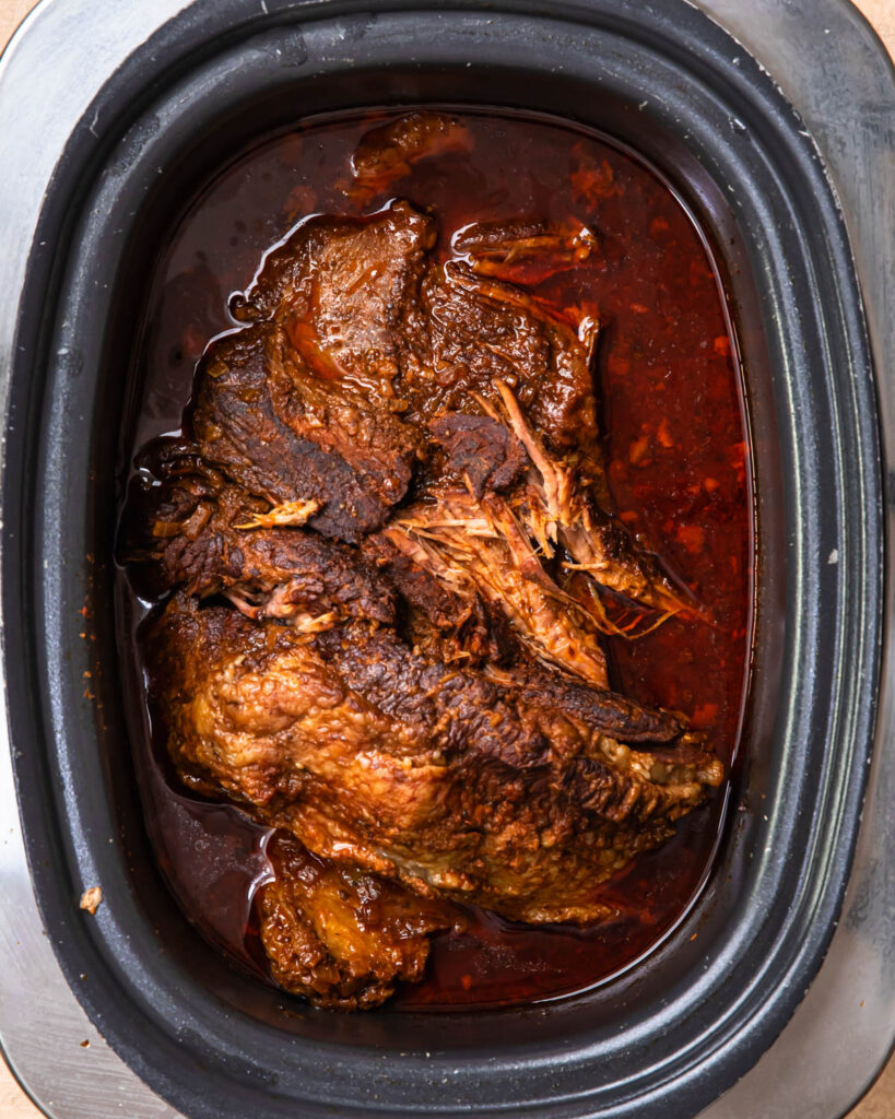 Slow cooked beef brisket in a slow cooker.