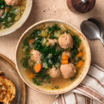 Close up photo of a bowl of slow cooker meatball soup.