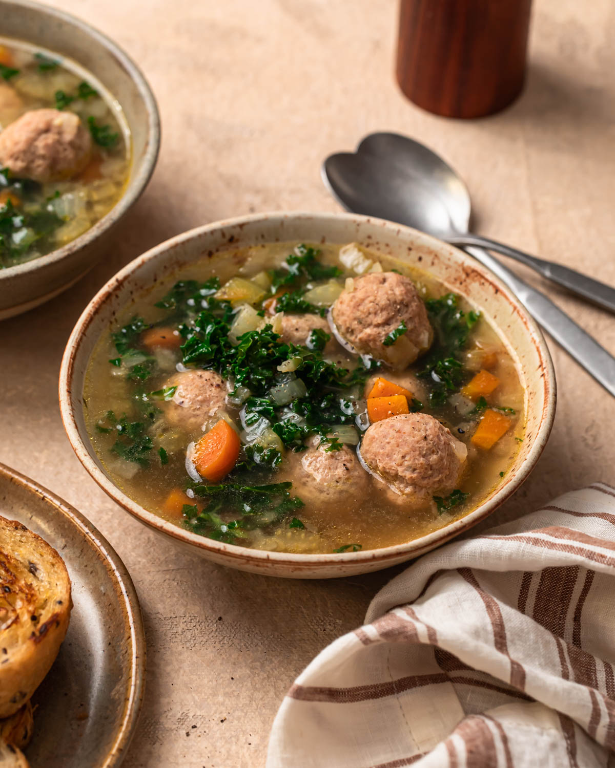 Front on photo of a bowl of Slow Cooker Meatball Soup.