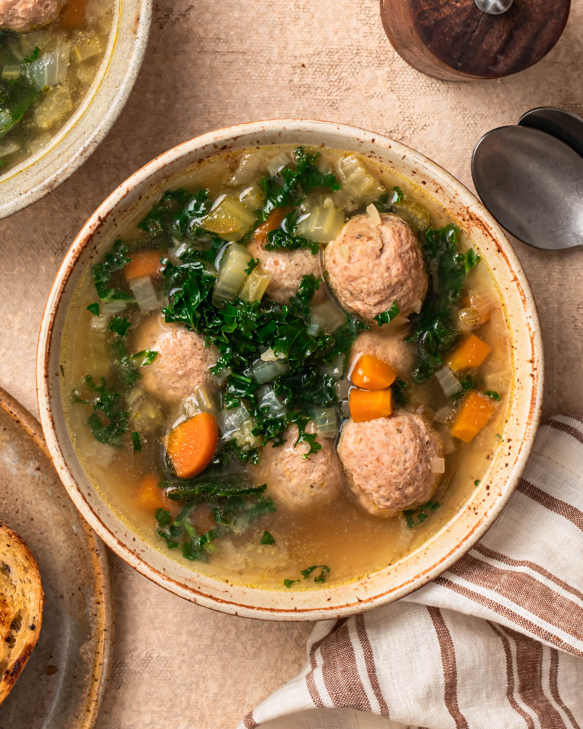 Close up photo of a bowl of slow cooker meatball soup.