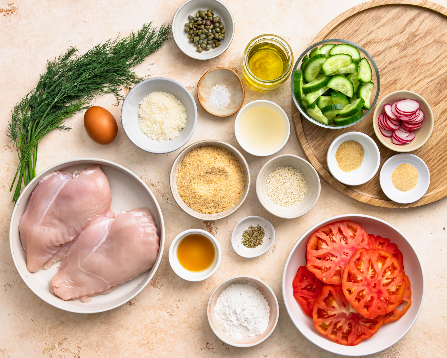 Ingredients needed to make baked parmesan breaded chicken.