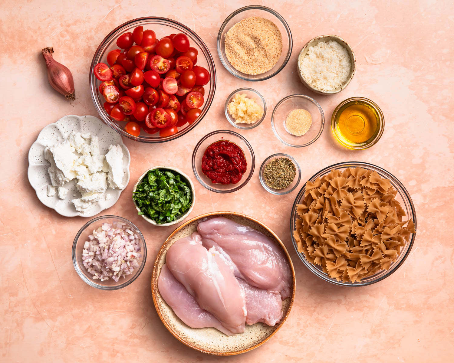 Ingredients needed to make tomato goat cheese pasta.