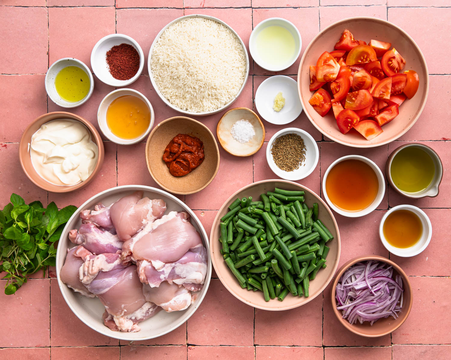 Ingredients needed to make harissa chicken bowls.