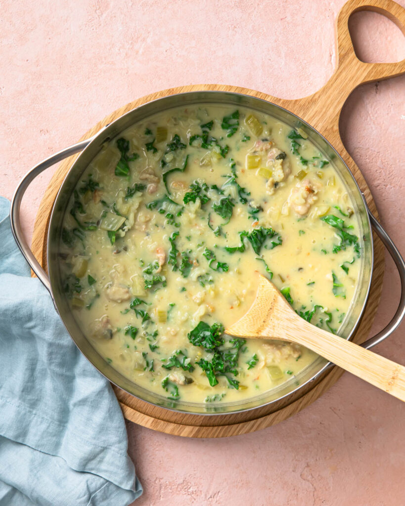 Finished chicken lemon rice soup in a large soup pot.