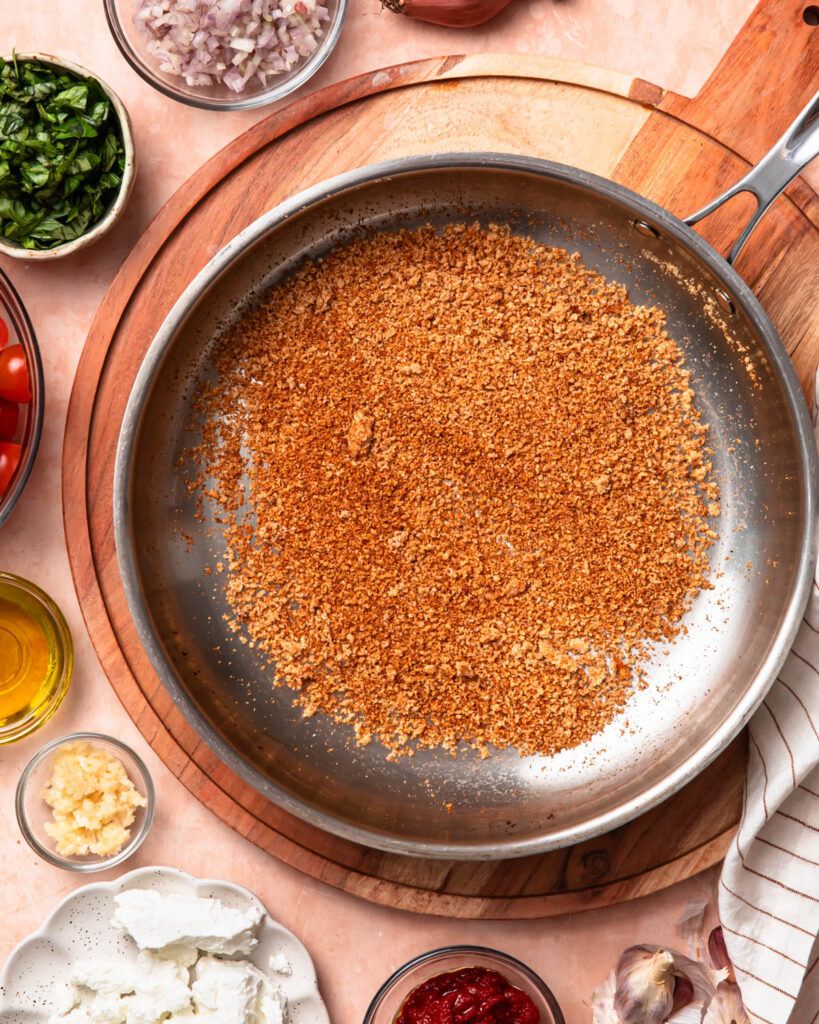 Toasting breadcrumbs in a small skillet.