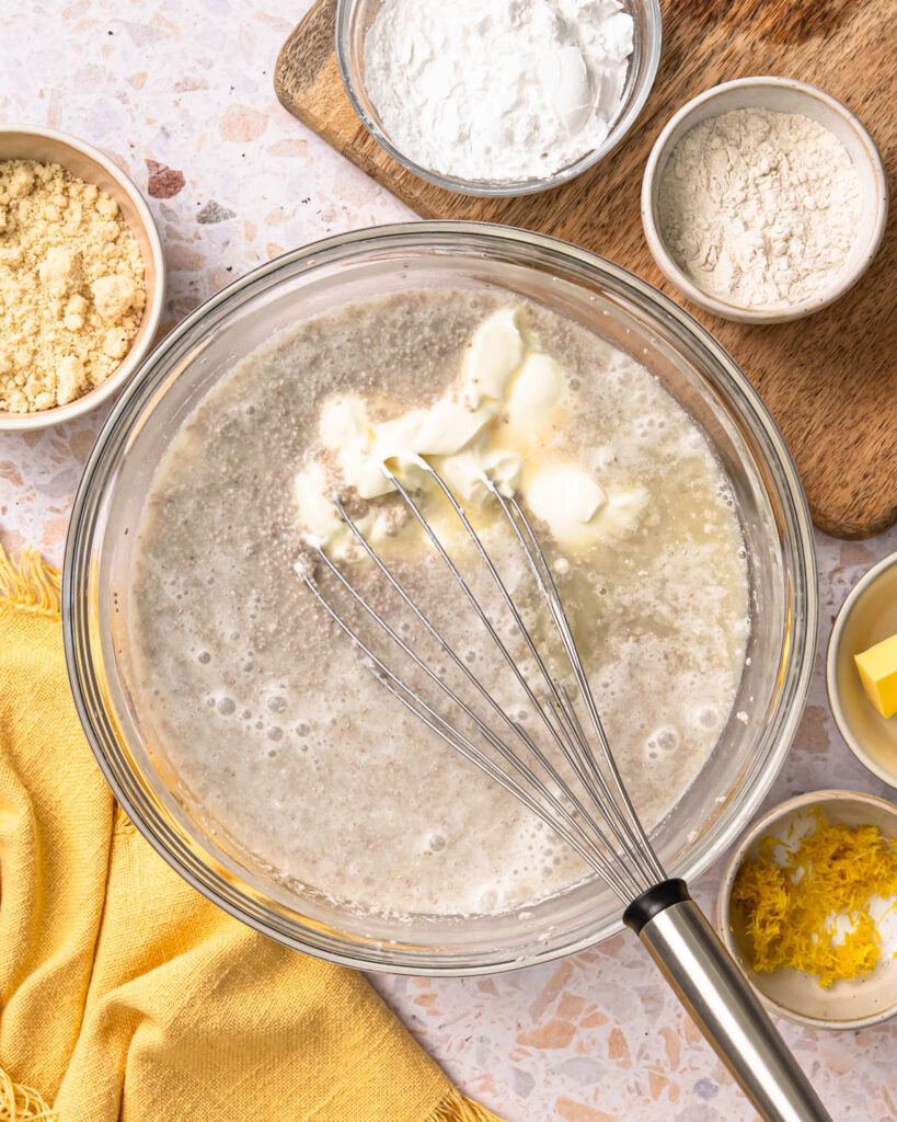 Whisking together the lemon chia pudding ingredients in a bowl.