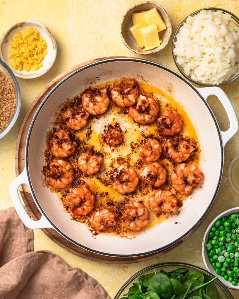 Prawns being cooked in a pan.