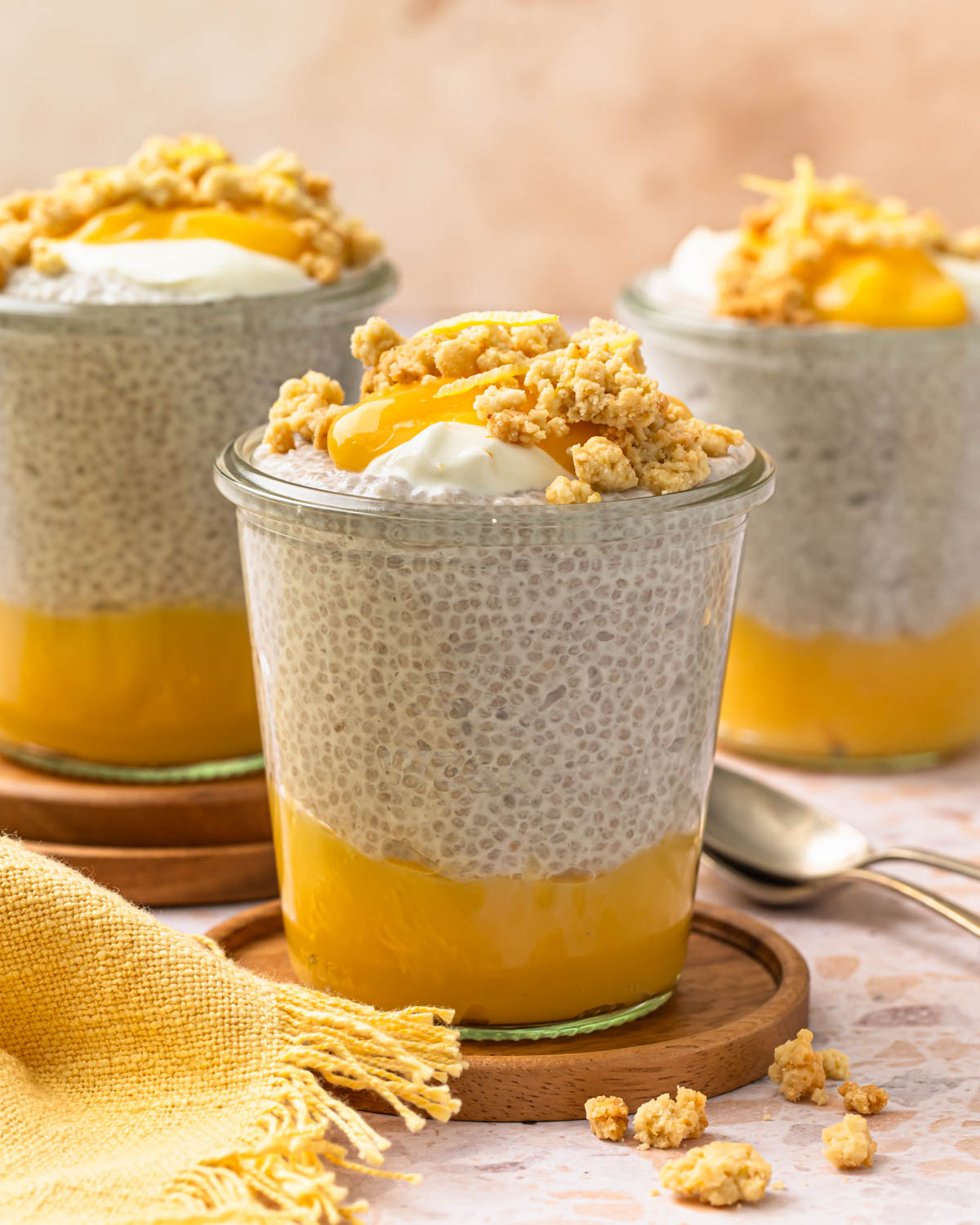 Side view of lemon chia pudding with golden crumb topping.
