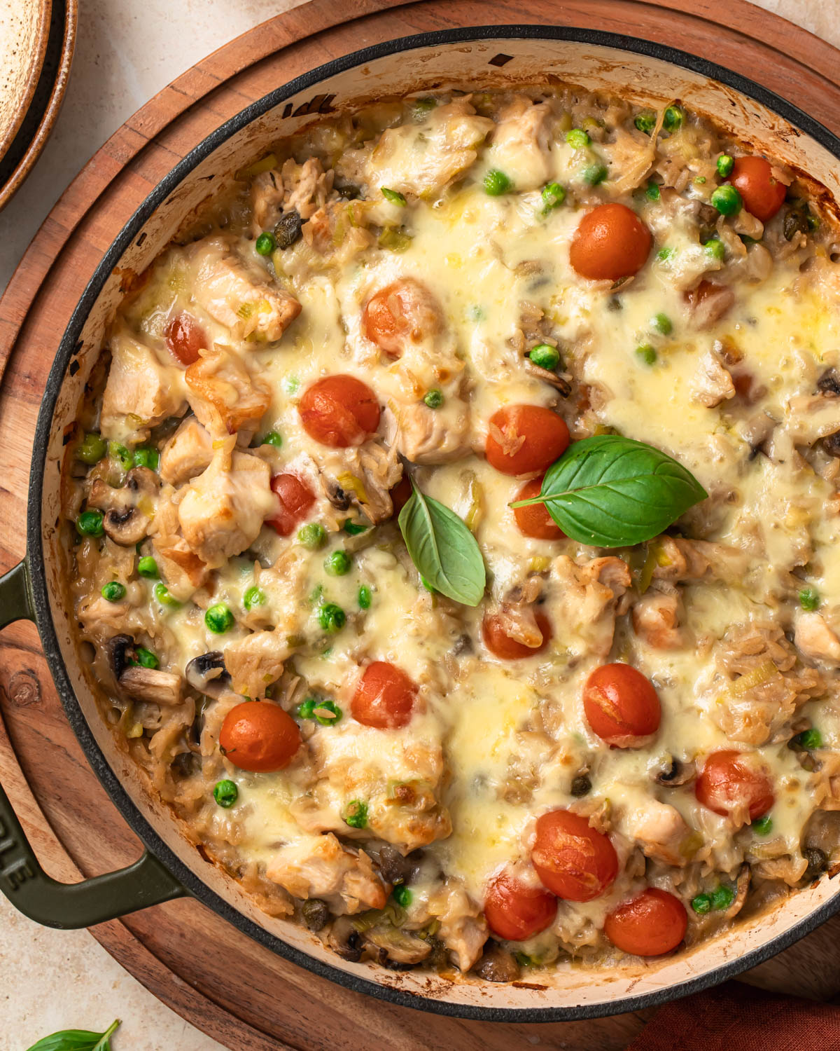 Close up of One pan chicken orzo pasta bake in a shallow casserole pan.