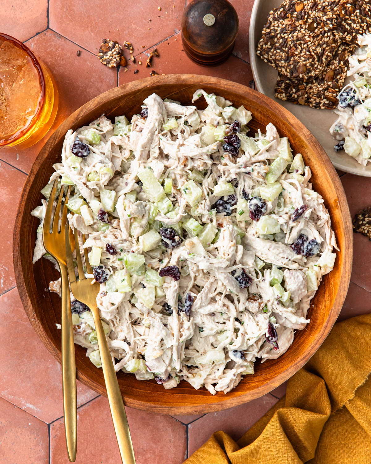 Cranberry walnut chicken salad all mixed together in a large salad bowl.